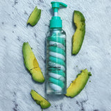 Luminous Avocado moisturizing body lotion with avocado slices on a marble background