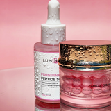 Luminous skincare products on a pink background