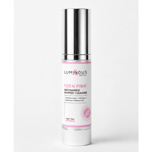 Luminous skin care product bottle with pink label on a white background