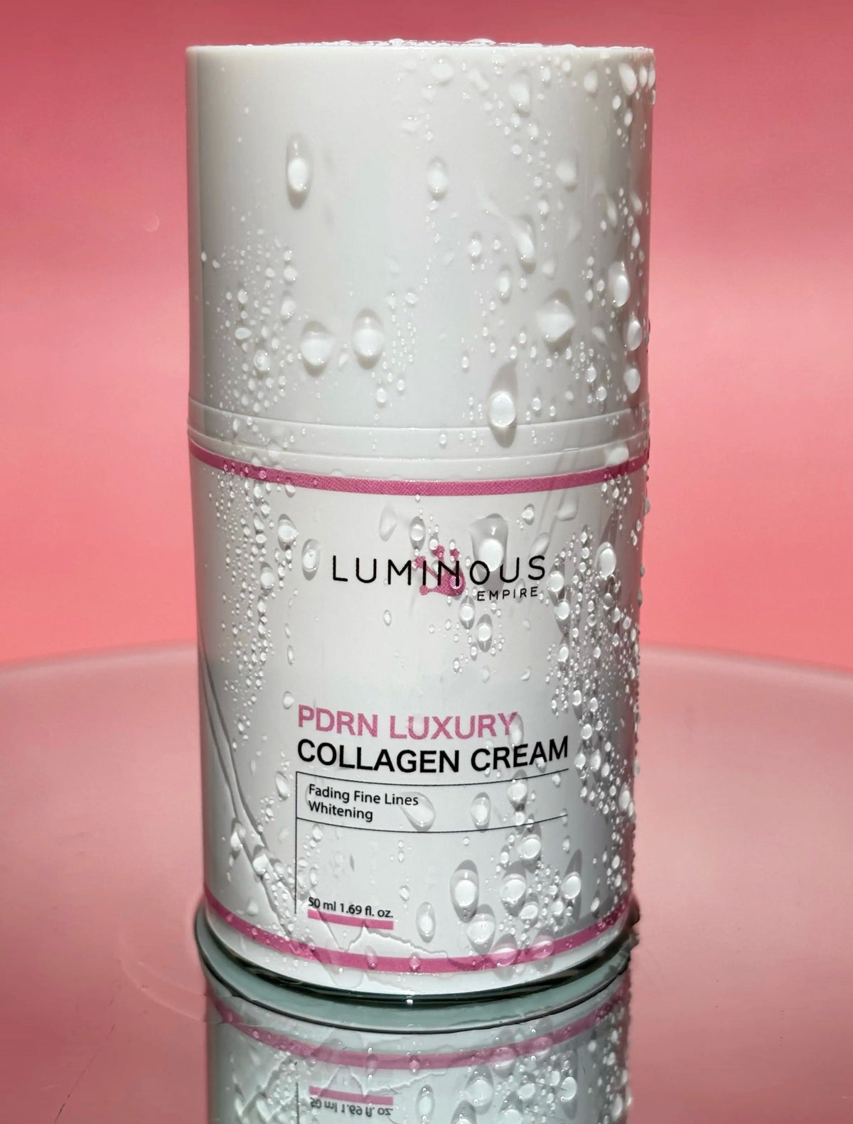 Luminous PDRN Luxury Collagen Cream container on a pink background