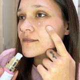 Woman applying Luminous empire PDRN Petptide Eye Cream skincare product to her face