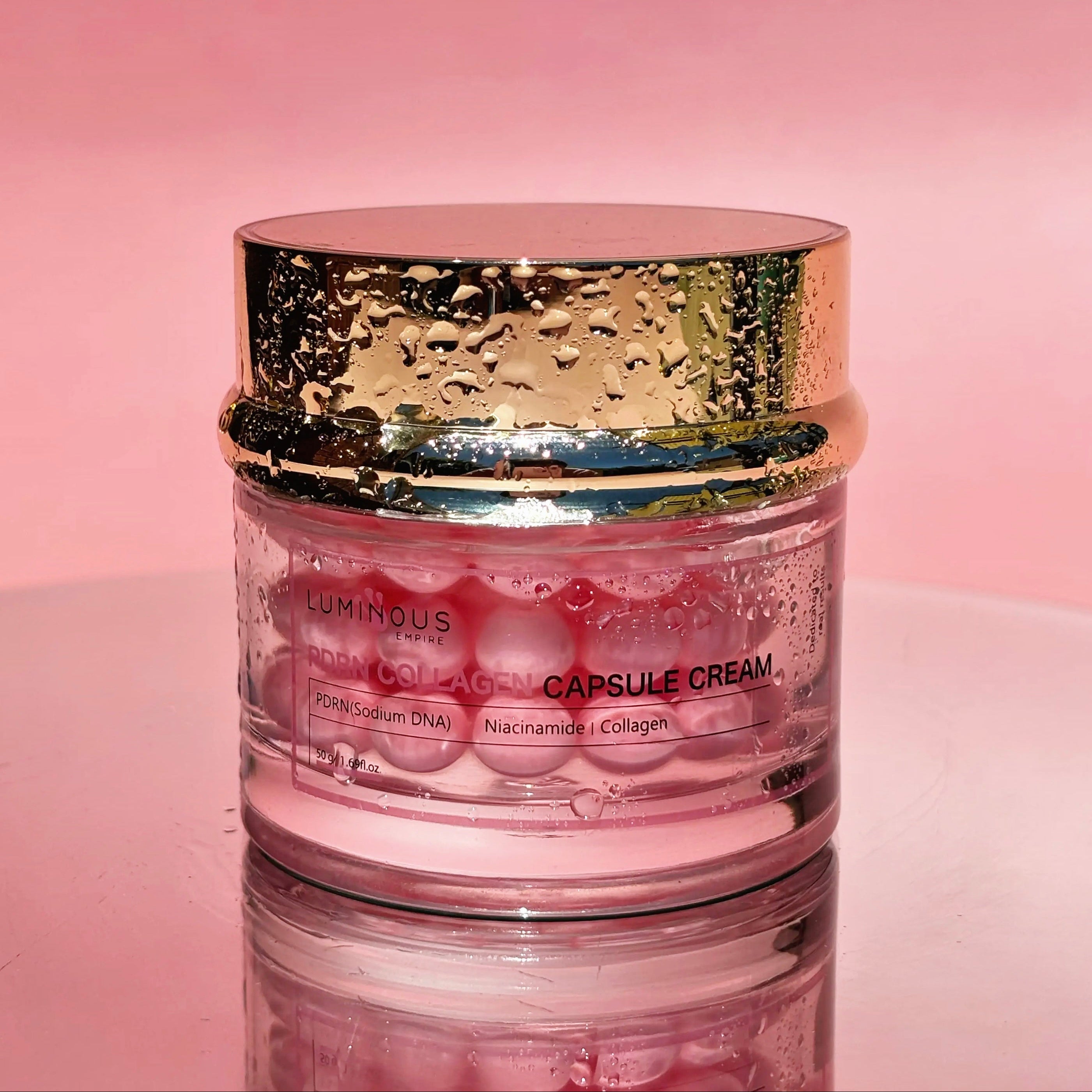 PDRN Collagen Capsule cream Jar with gold lid on a pink background