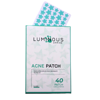 LUMINOUS EMPIRE Acne Patch box with a single star-patterned patch peeking out from the top, on a plain white background.